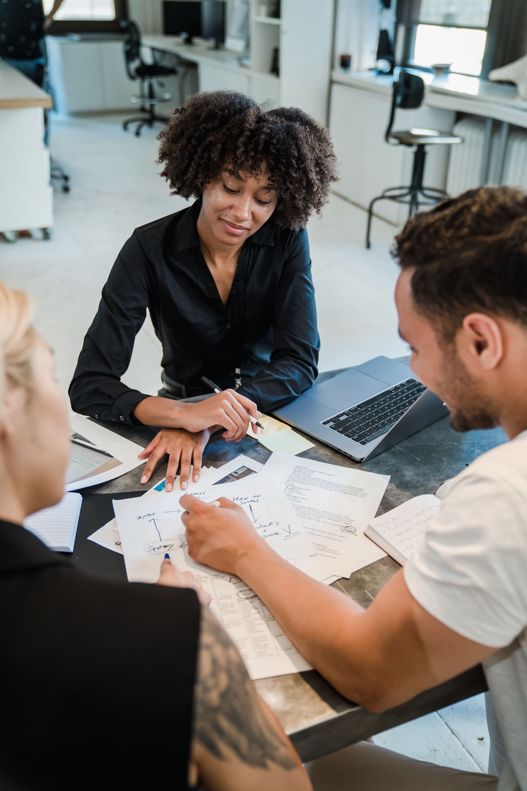 People planning work around a table